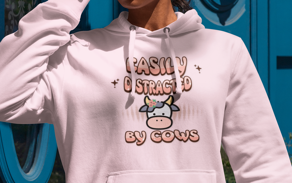 Easily Distracted by Cows Hoodie – Funny Farm Graphic Sweatshirt, Cow Lover Unisex Pullover Printify Hoodie Nordic Seoul Designs LLC